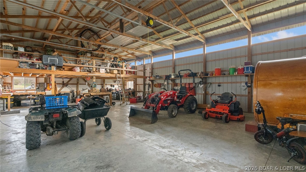 46 County Rd MM-10 Eugene, MO 65032 - Photo 54 of 65 Expansive garage & workshop with extra storage abo