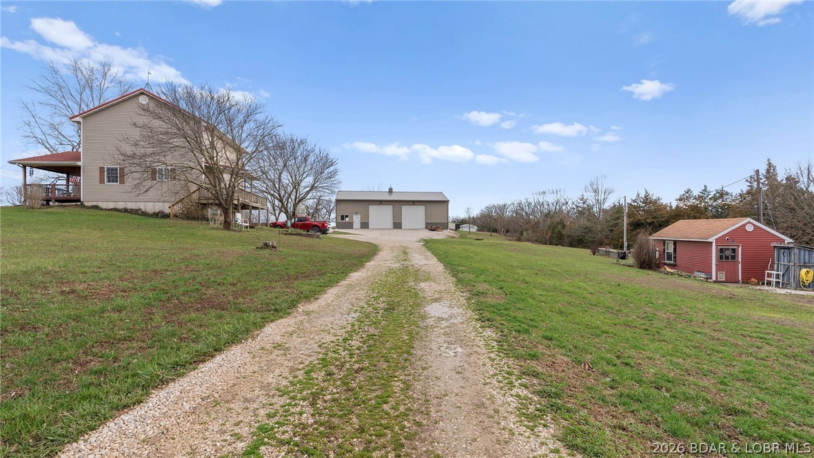 46 County Rd MM-10 Eugene, MO 65032 - Photo 56 of 65 side view of home, shop, and green house