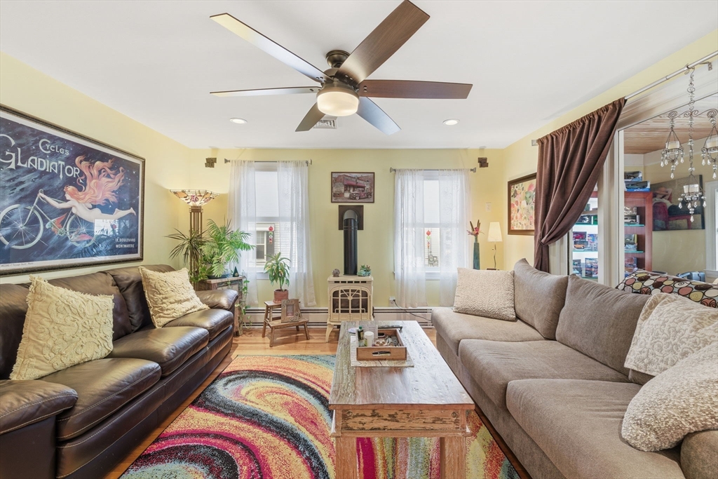 5 West Kenneth Street Lawrence, MA 01843 - Photo 11 of 41 a living room with furniture and a large window
