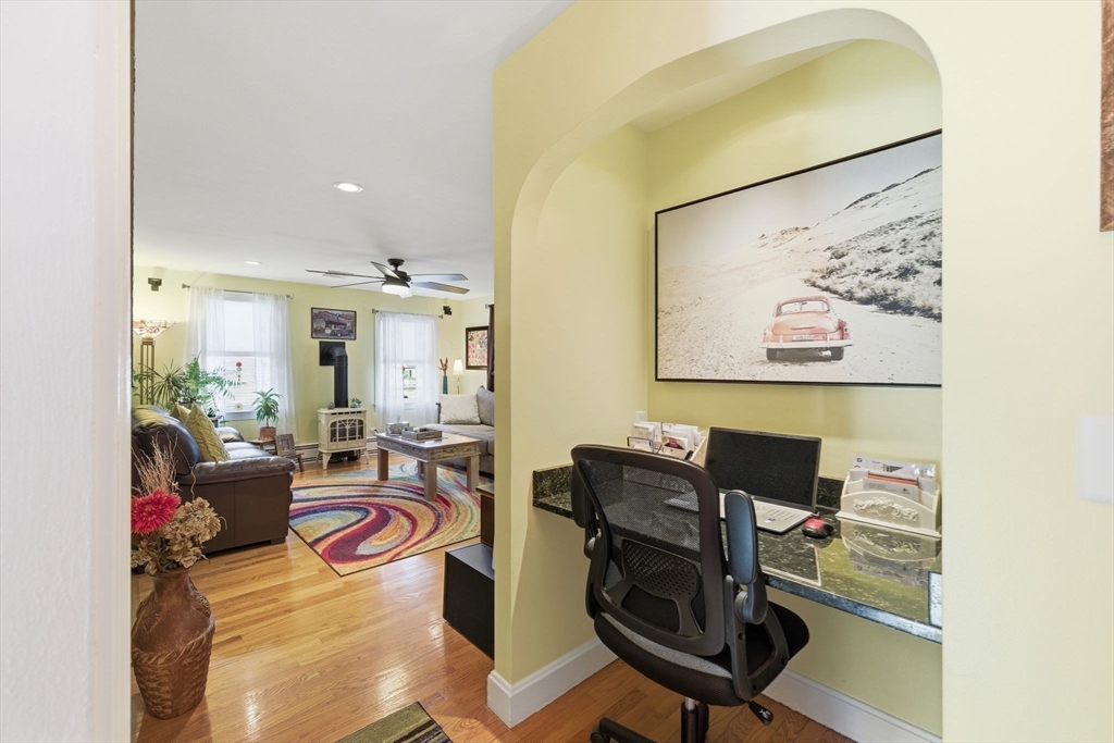 5 West Kenneth Street Lawrence, MA 01843 - Photo 16 of 41 a view of a workspace with furniture and a potted plant
