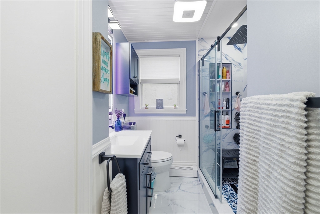 5 West Kenneth Street Lawrence, MA 01843 - Photo 20 of 41 a bathroom with a sink toilet and shower