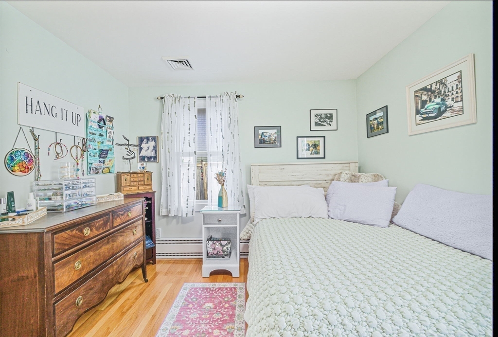 5 West Kenneth Street Lawrence, MA 01843 - Photo 23 of 41 a bed room with a bed and a couch