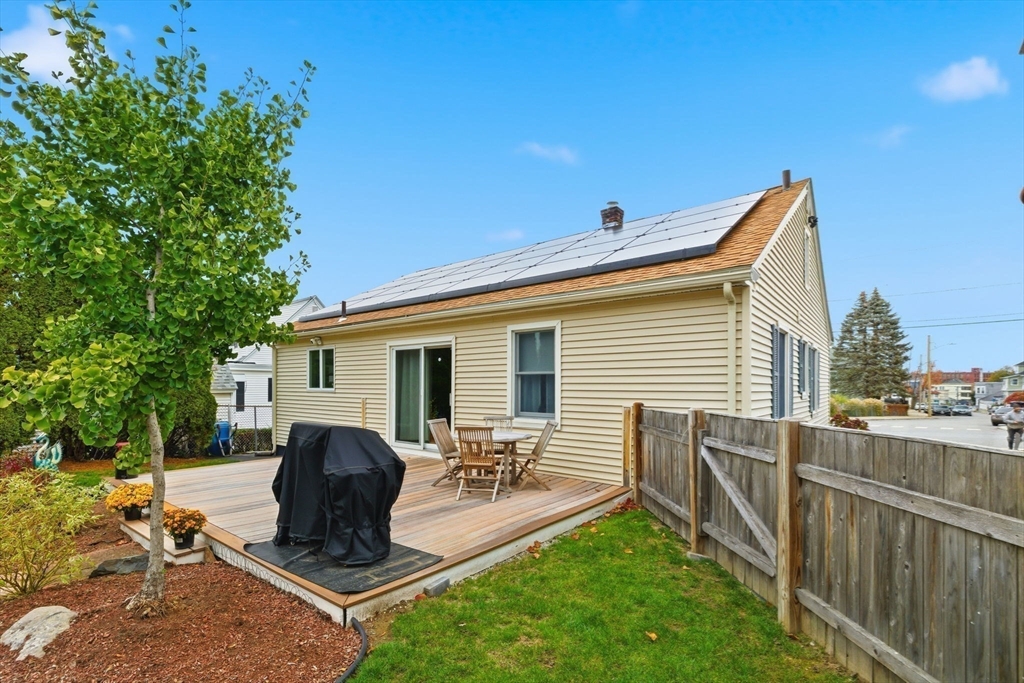 5 West Kenneth Street Lawrence, MA 01843 - Photo 29 of 41 a front view of house with yard having outdoor seating