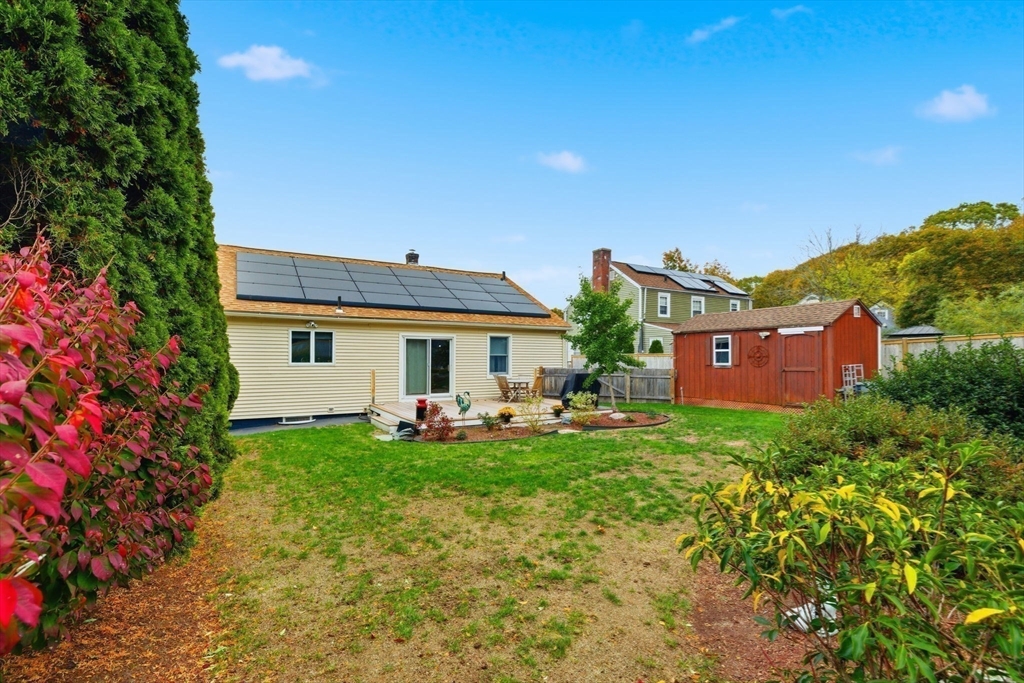 5 West Kenneth Street Lawrence, MA 01843 - Photo 30 of 41 a view of a house with backyard sitting area and garden