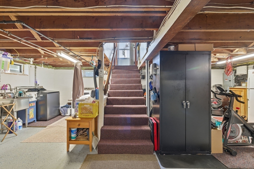 5 West Kenneth Street Lawrence, MA 01843 - Photo 32 of 41 a view of entryway with stairs and a living room view