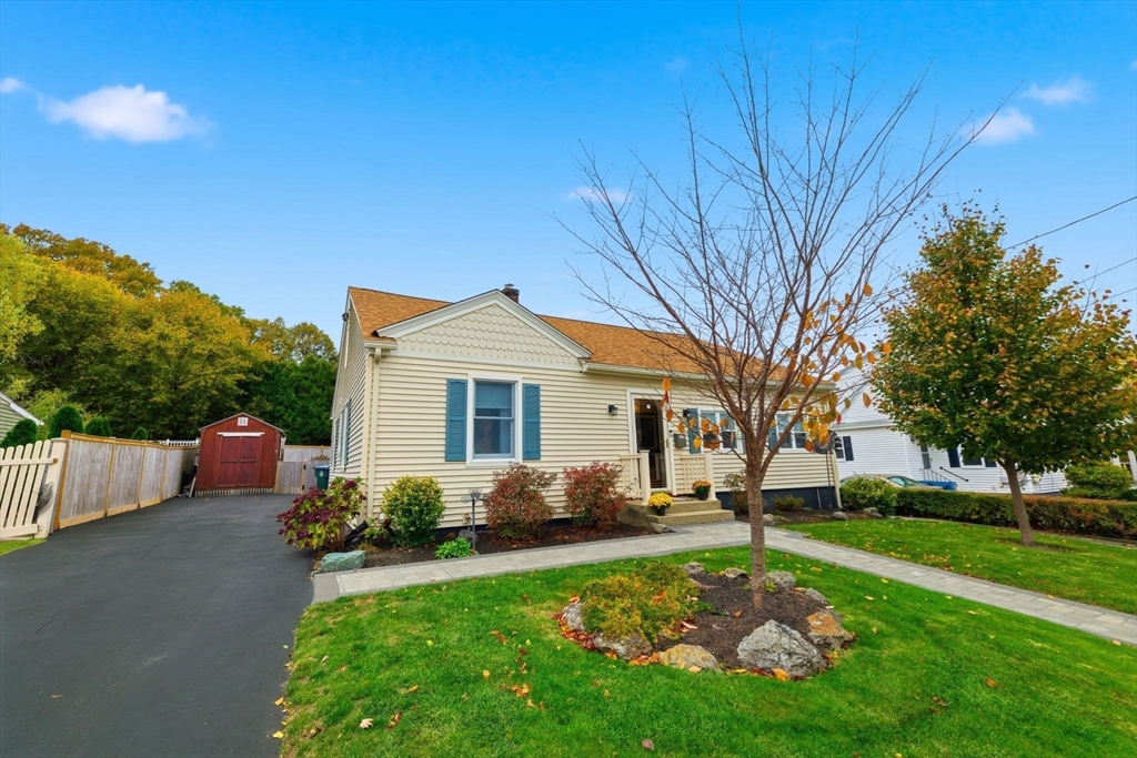 5 West Kenneth Street Lawrence, MA 01843 - Photo 4 of 41 a front view of house with yard and green space