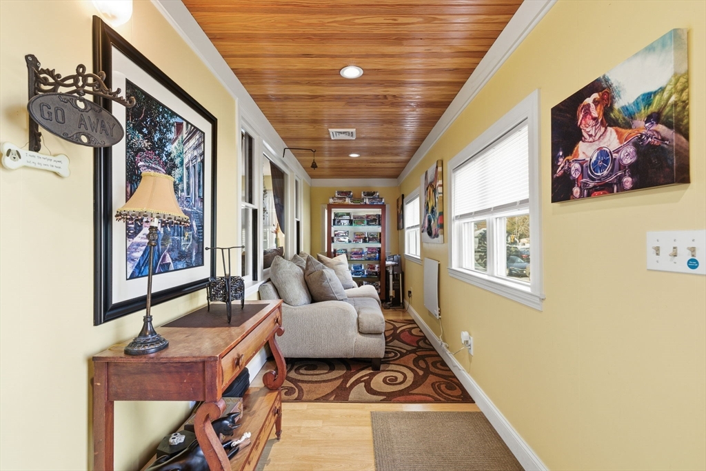 5 West Kenneth Street Lawrence, MA 01843 - Photo 6 of 41 a living room with furniture and a flat screen tv