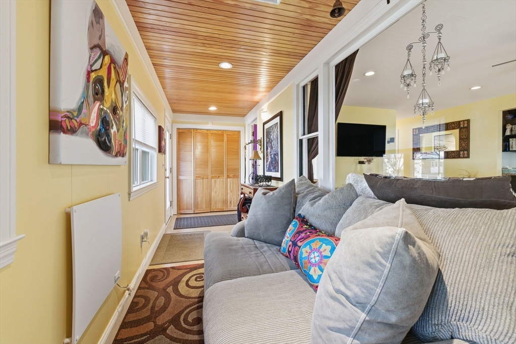 5 West Kenneth Street Lawrence, MA 01843 - Photo 7 of 41 a living room with furniture and a flat screen tv