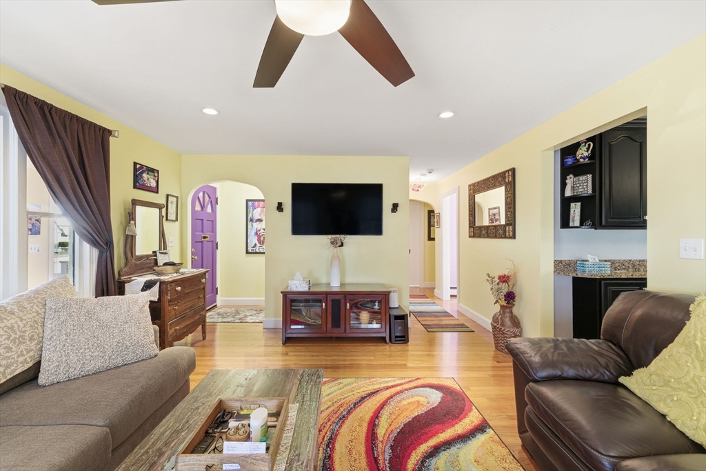 5 West Kenneth Street Lawrence, MA 01843 - Photo 10 of 41 a living room with fireplace furniture and a flat screen tv