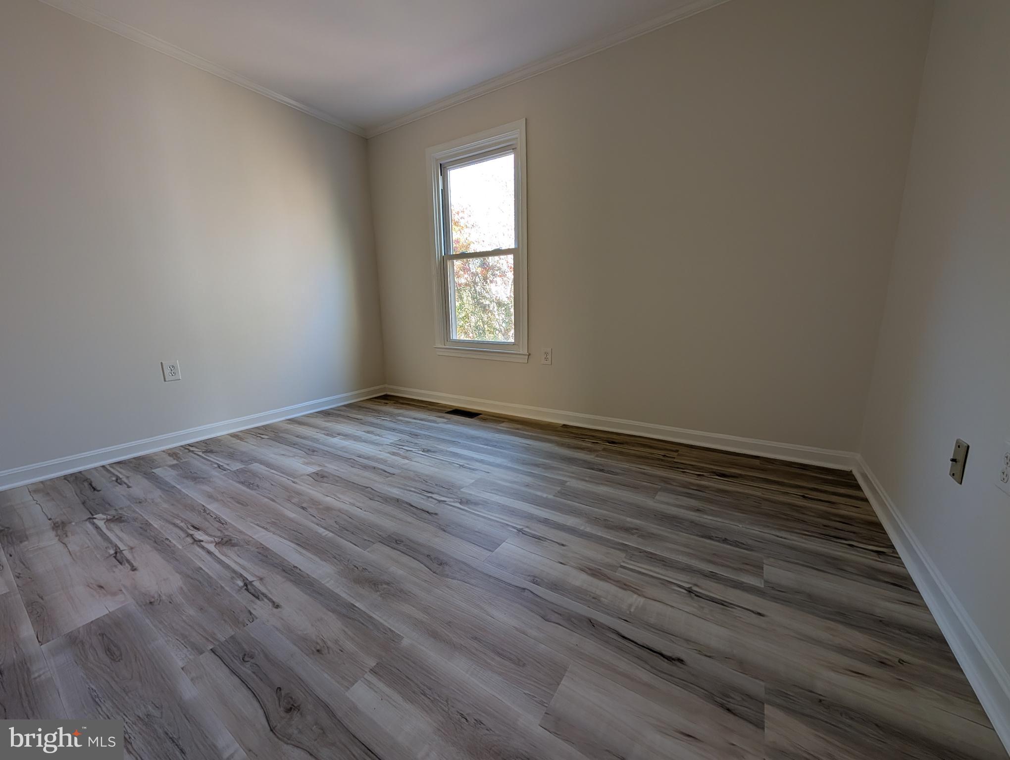 8108 Squirrel Run Road Springfield, VA 22152 - Photo 13 of 16 wooden floor in an empty room