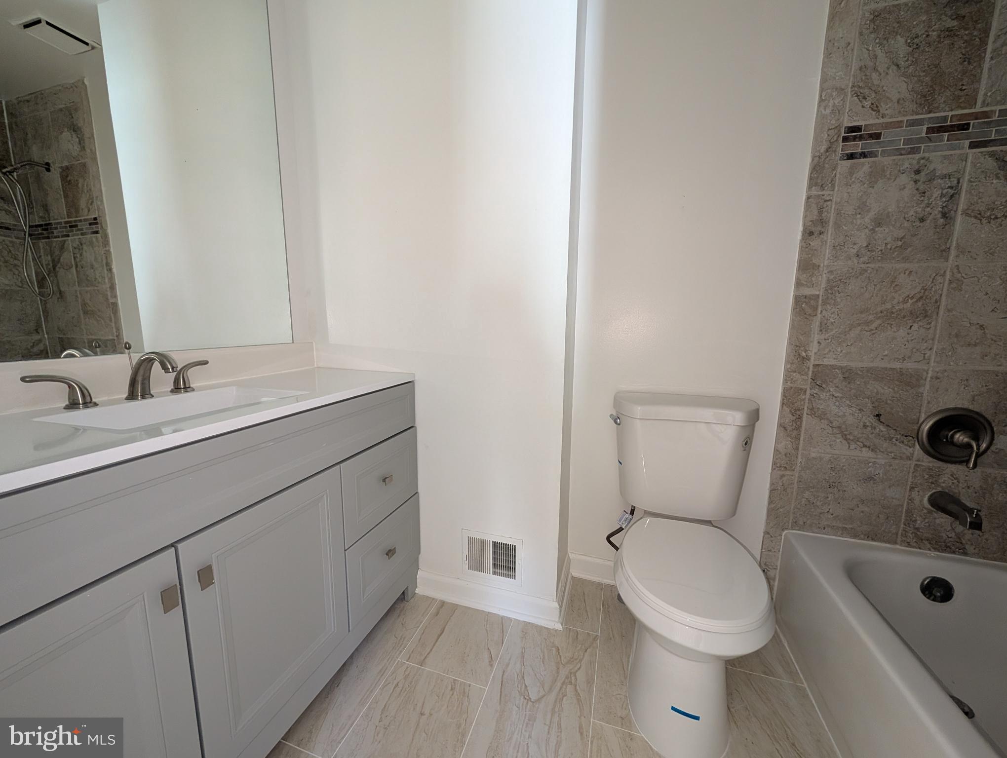 8108 Squirrel Run Road Springfield, VA 22152 - Photo 9 of 16 a bathroom with a sink a toilet and shower