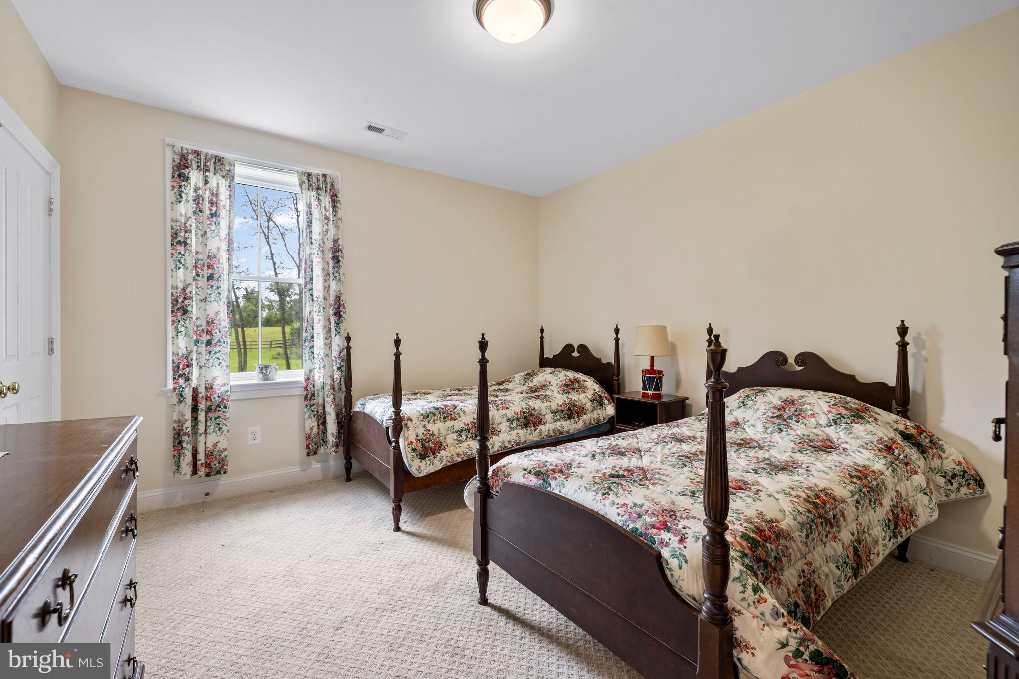 20147 Woodtrail Road Round Hill, VA 20141 - Photo 30 of 41 a bed room with two bed and a window