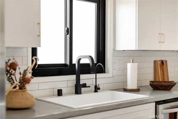 a kitchen with a sink and a window
