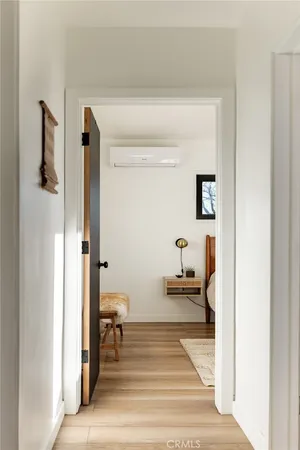 a bedroom with bed and window