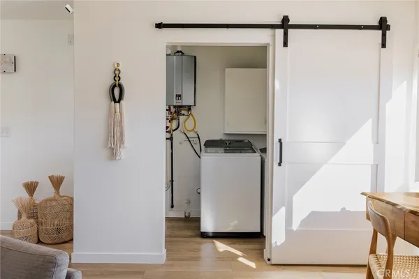 a view of door with wooden floor