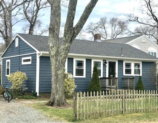 87 Parkwood Drive Wareham, MA 02571 - Photo 1 of 22 a front view of a house with a garden