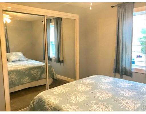 87 Parkwood Drive Wareham, MA 02571 - Photo 11 of 22 a bedroom with a bed and a window