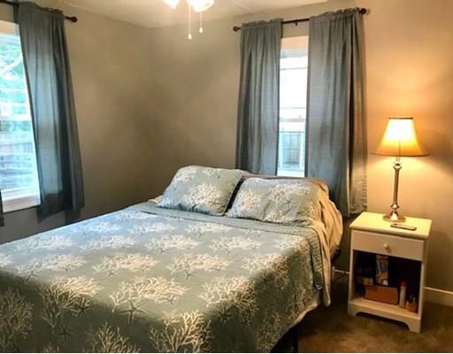 87 Parkwood Drive Wareham, MA 02571 - Photo 12 of 22 a bedroom with a bed and a lamp