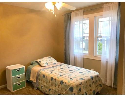 87 Parkwood Drive Wareham, MA 02571 - Photo 14 of 22 a bedroom with a bed and a window