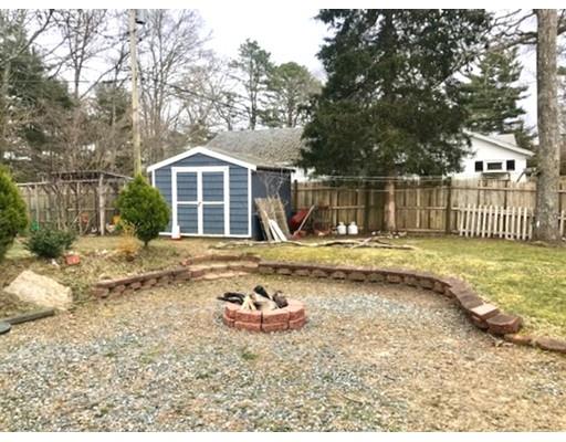 87 Parkwood Drive Wareham, MA 02571 - Photo 18 of 22 a front view of a house with a yard