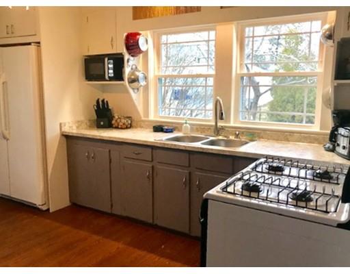 87 Parkwood Drive Wareham, MA 02571 - Photo 9 of 22 a kitchen with stainless steel appliances a sink stove and cabinets