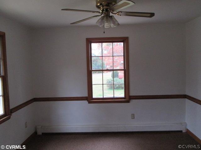 3940 Tanbark Road Richmond, VA 23235 - Photo 4 of 10 a bathroom with a bathtub and a window