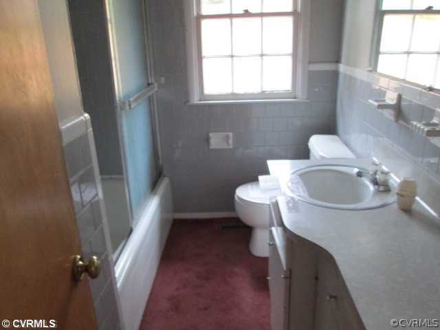 3940 Tanbark Road Richmond, VA 23235 - Photo 10 of 10 a bathroom with a sink a toilet and a window