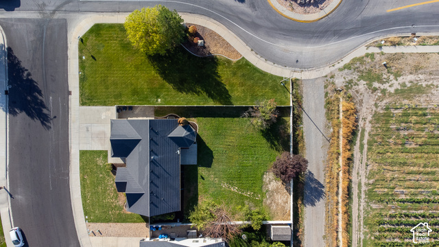 1742 Renaissance Way Springville, UT 84663 - Photo 21 of 23 Property with a dark shingled roof, a paved driveway, and expansive manicured lawns