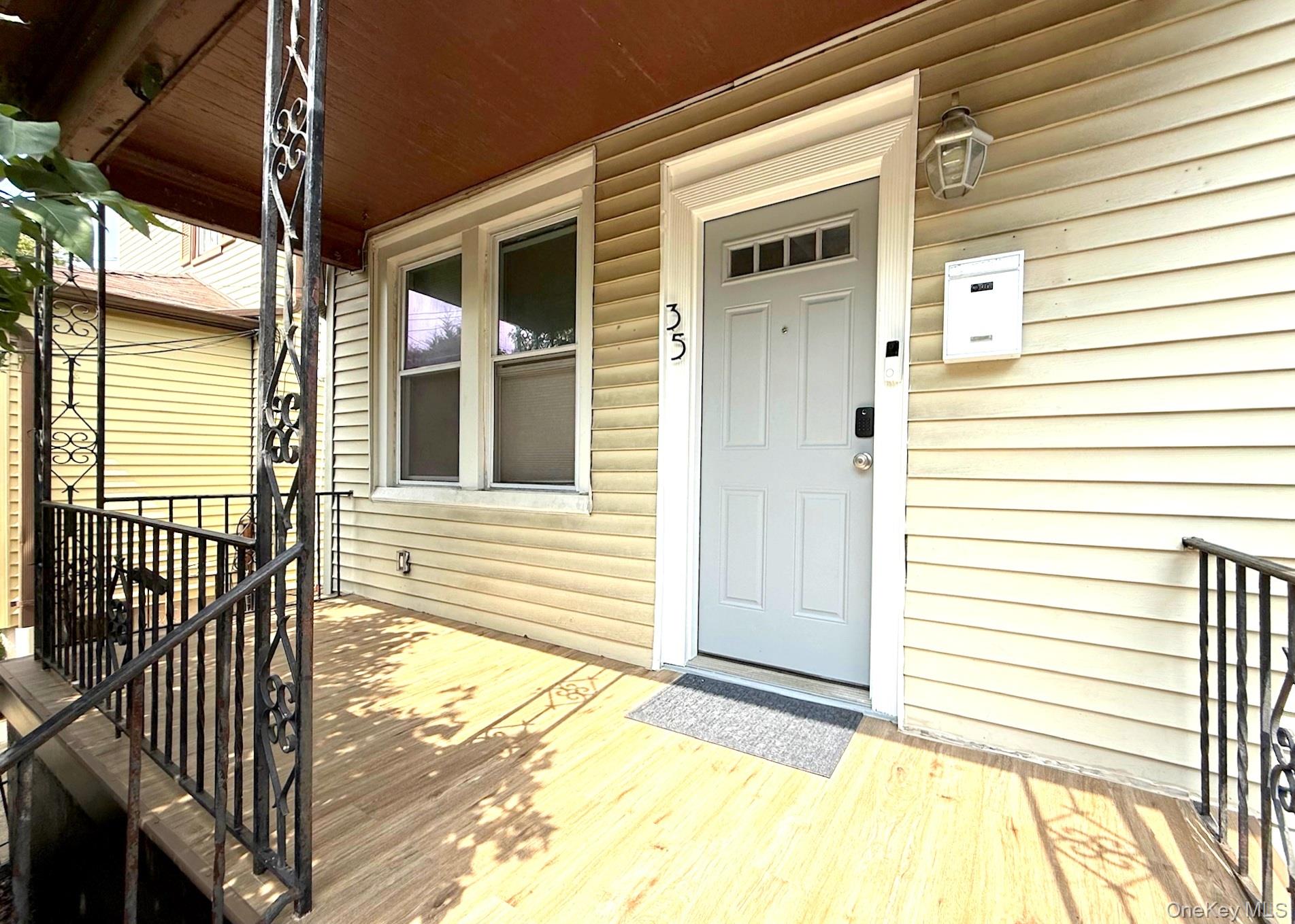35 7th Street New Rochelle, NY 10801 - Photo 1 of 18 a view of a porch with a table and chairs