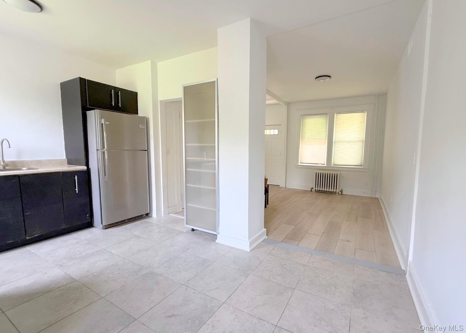 35 7th Street New Rochelle, NY 10801 - Photo 16 of 18 a view of a kitchen with refrigerator and cabinet