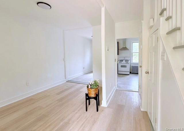 35 7th Street New Rochelle, NY 10801 - Photo 2 of 18 a living room with furniture and a wooden floor