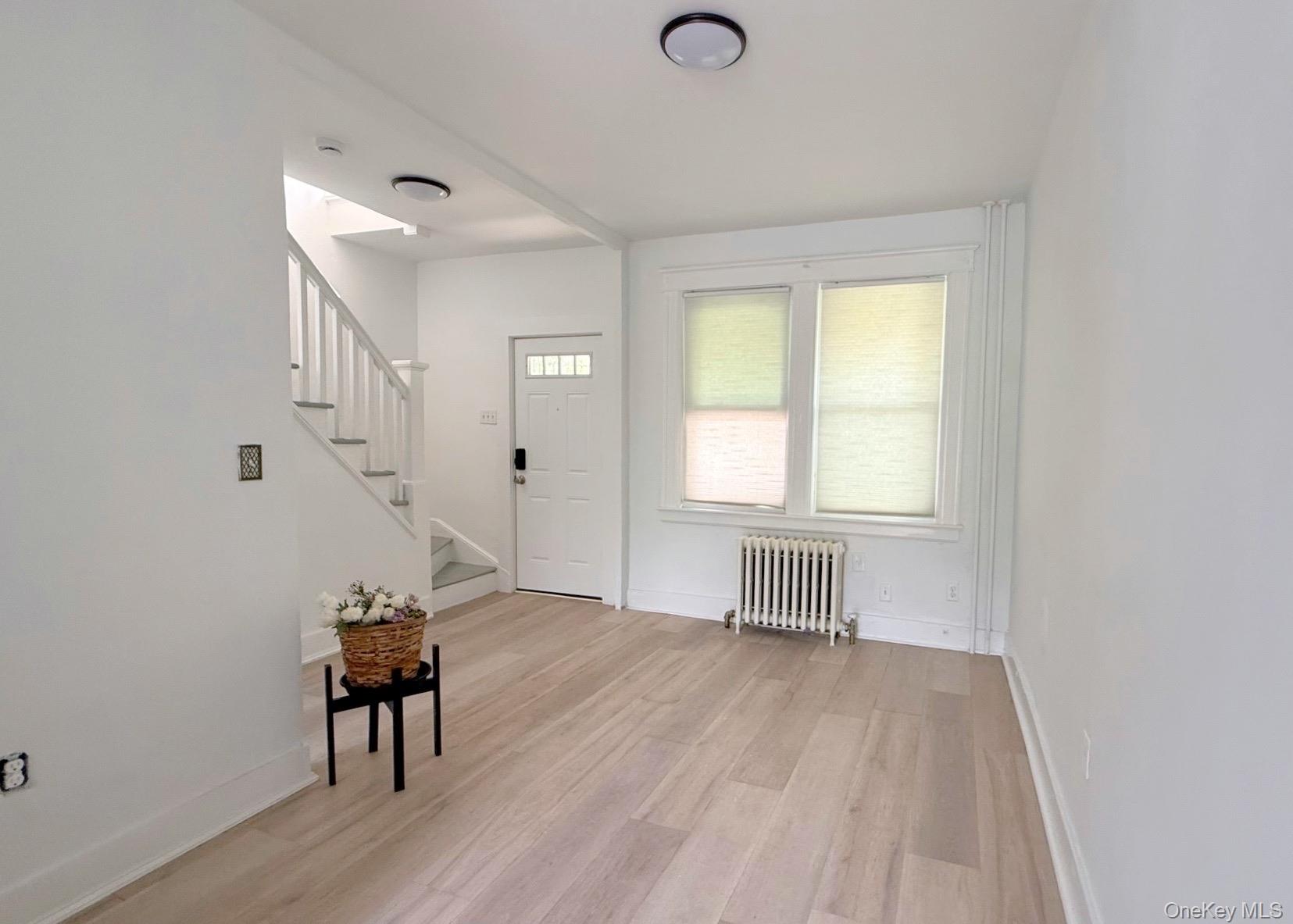 35 7th Street New Rochelle, NY 10801 - Photo 3 of 18 a view of empty room with wooden floor
