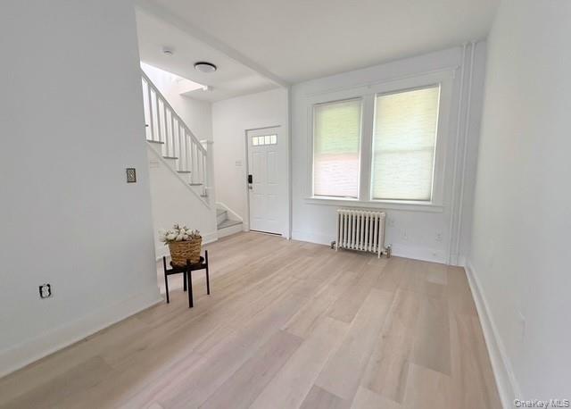 35 7th Street New Rochelle, NY 10801 - Photo 5 of 18 an empty room with piano table and windows