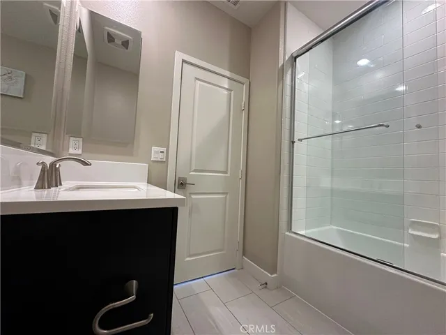 a bathroom with a sink and mirror