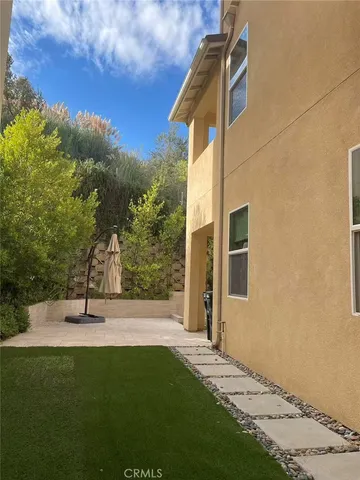 a house view with garden space