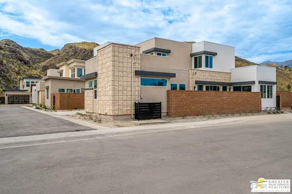 a front view of a building with a road