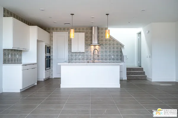 a view of a kitchen with a sink