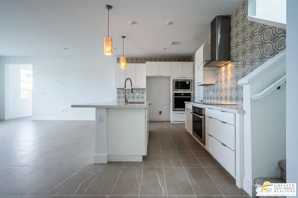a kitchen with a sink and a window