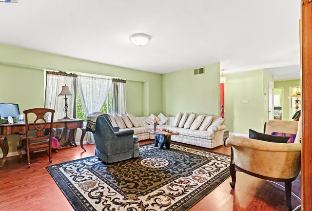a living room with furniture and a rug