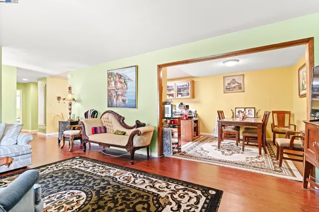a living room with furniture and a rug