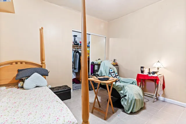 a bedroom with a bed and a closet