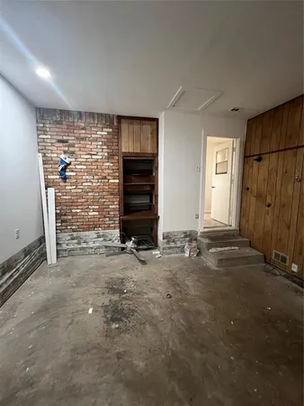 an empty room with a fireplace