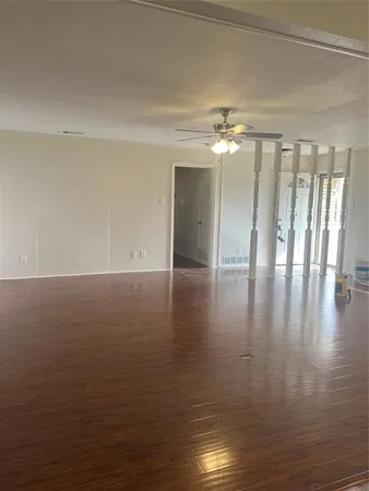 a view of room with hardwood floor