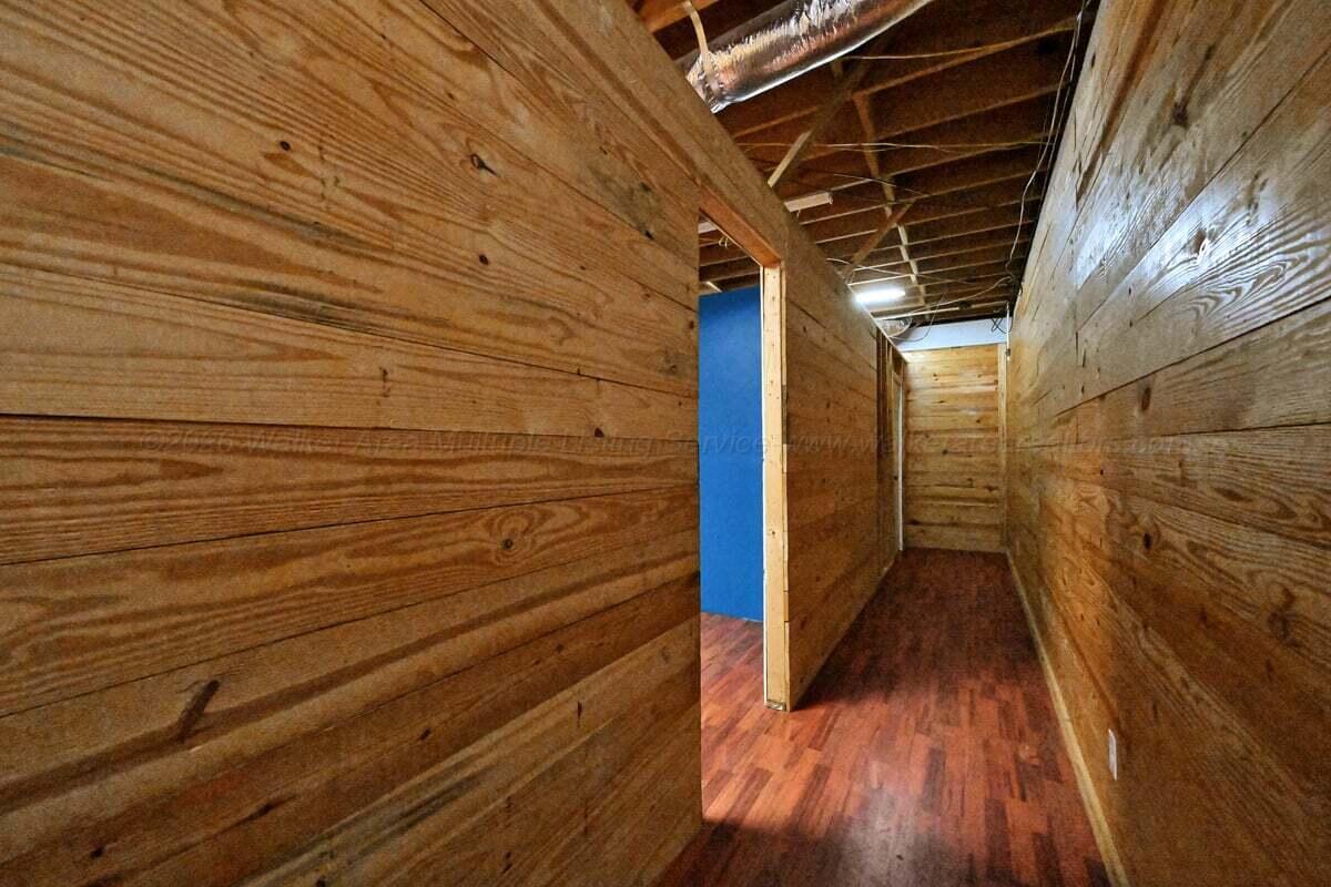 196 County Road 3706 Addison, AL 35540 - Photo 34 of 49 Hallway to 4th and 5th rooms and bath in basement