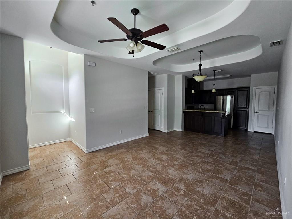 1819 South Texas Boulevard Weslaco, TX 78596 - Photo 2 of 8 a view of empty room with wooden floor and ceiling fan
