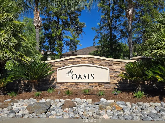 a sign that is on a brick wall