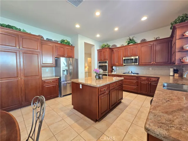 a kitchen with granite countertop lots of counter top space