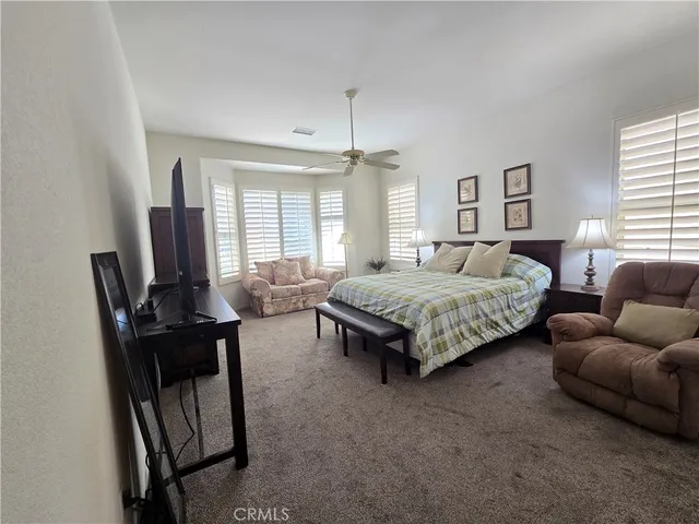 a spacious bathroom with a double vanity sink a mirror and a bathtub