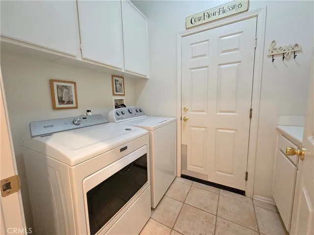 a patio with a table and chairs