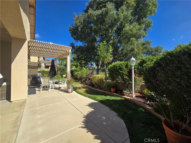 a view of a chairs and tables in the patio